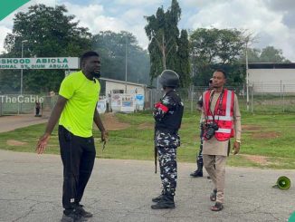 Trending photos: Protester Confronts Police Amid Teargas Barrage in Abuja