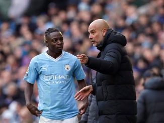 Jeremy Doku and Pep Guardiola