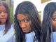 Lady reveals the ridiculous transformation in her bone-straight wig after being caught in a heavy downpour (WATCH)
